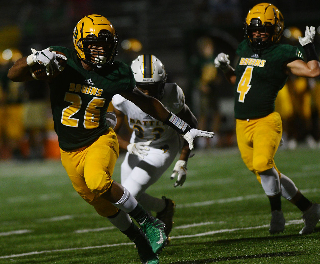 Rock Bridge junior running back Bryce Jackson runs